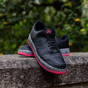 Black Nike Air Force with neon pink accents